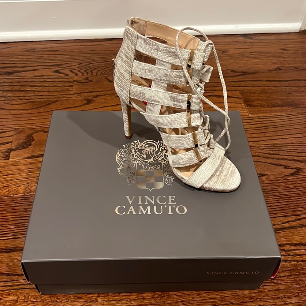 Never worn in box 
White and taupe leather tie up heel s 6.5. Vince Camuto